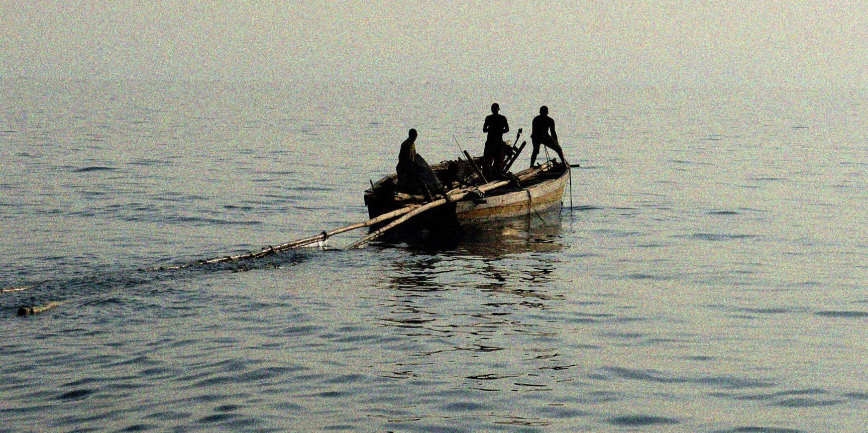 Fishermen at Lake Tanganyika heading out into the open waters in the evening for casting their nets (© Benedikt Ehrenfels).