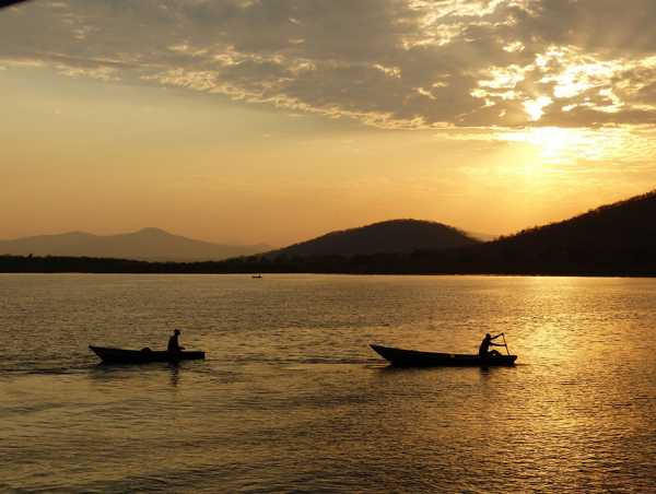 Two fishermen in the morning light